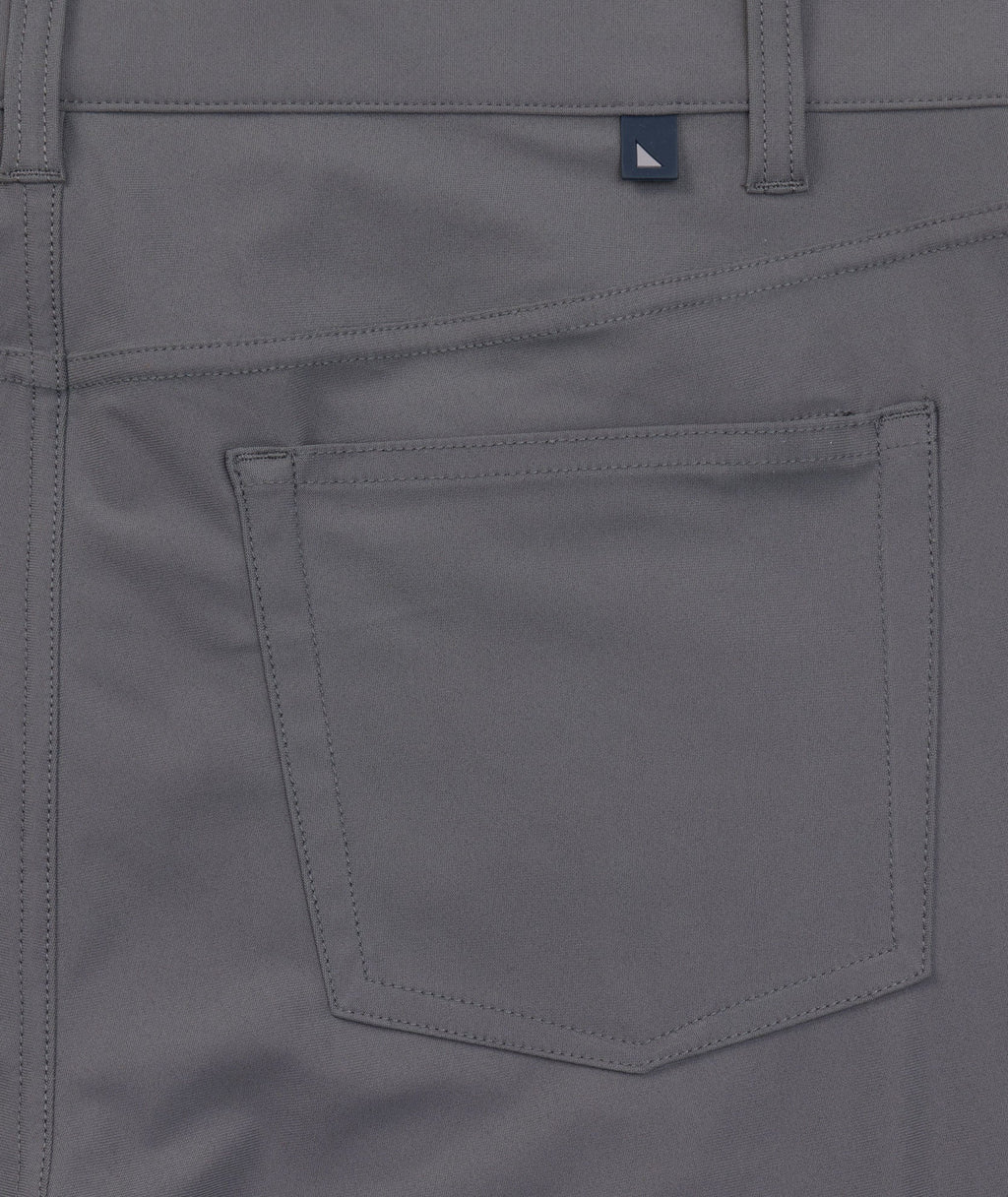Model is wearing UNTUCKit 5-Pocket Performance Tech Pants in Gray.