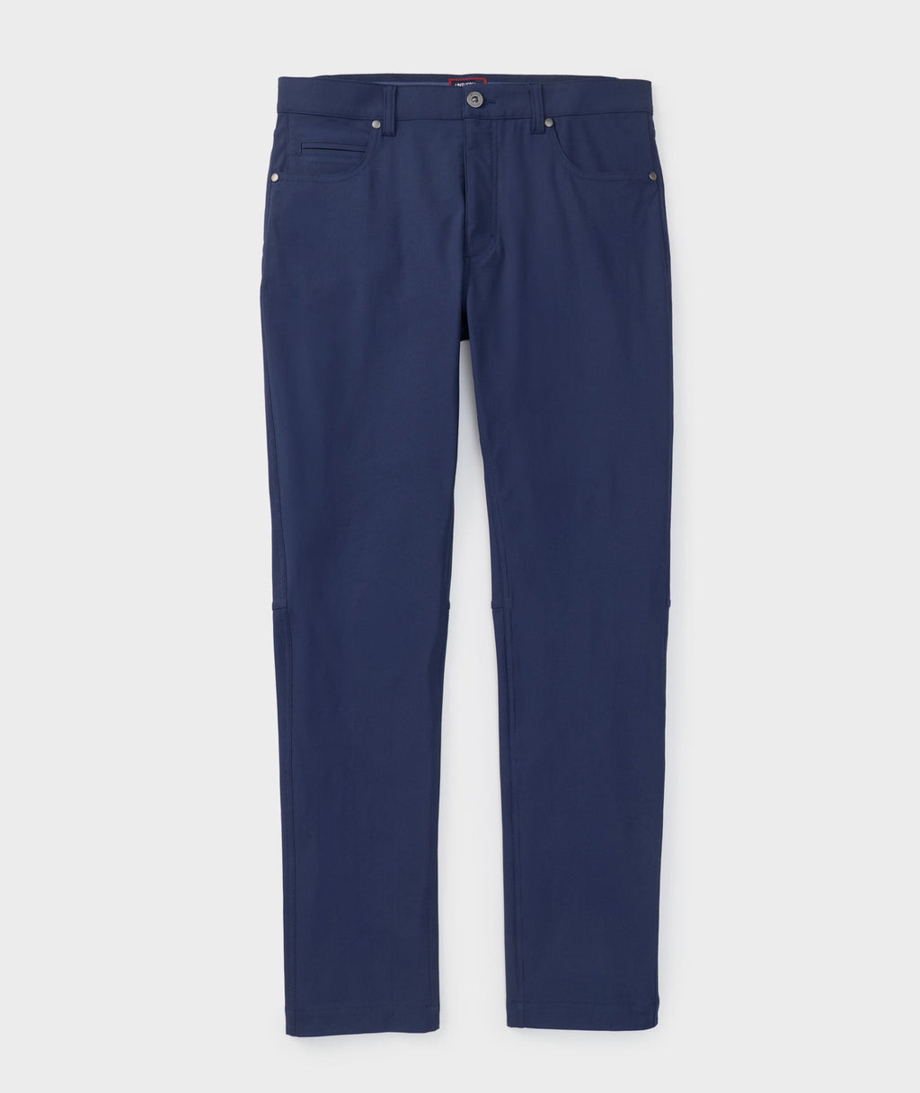 Model is wearing UNTUCKit 5-Pocket Performance Tech Pants in Navy.