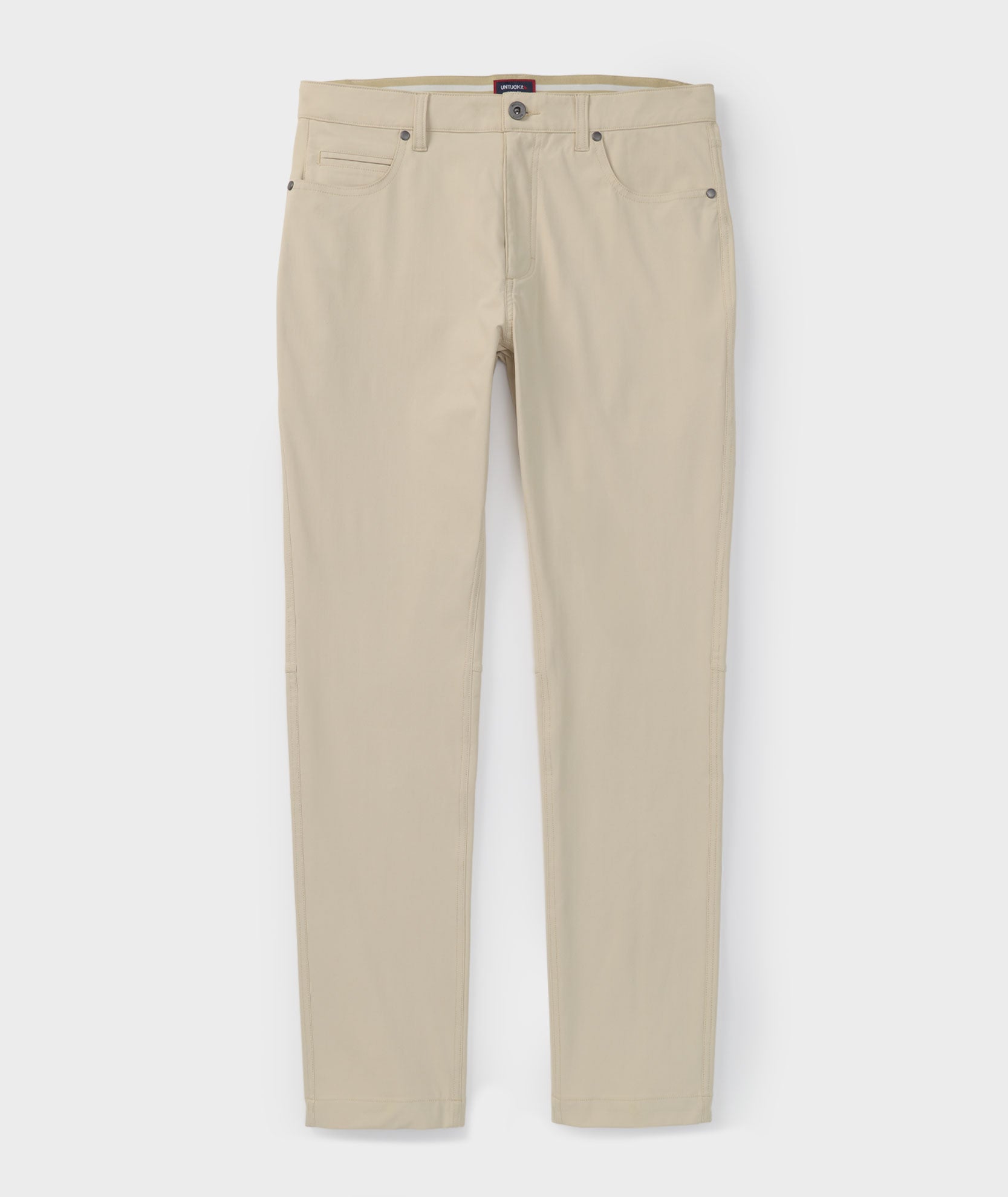 Model is wearing UNTUCKit 5-Pocket Performance Tech Pants in Tan.